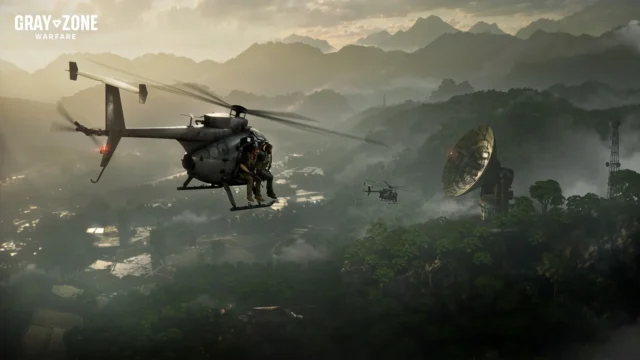 グレーゾーン ウォーフェアのゲーム画面。山岳地帯の上空を飛ぶヘリと electronic パラボラアンテナ