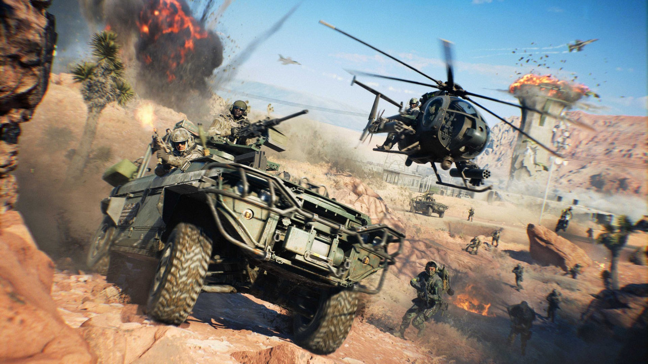 『Battlefield 6』新マップ「Area 51」のスクリーンショット。ヨシュアツリーが生える砂漠の斜面を武装車両が駆け下り、すぐ横を小型ヘリコプターが飛ぶ